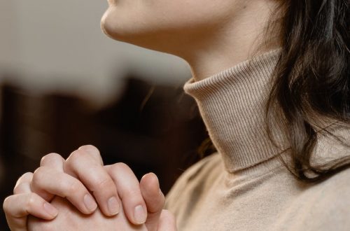 close up view of a woman praying
