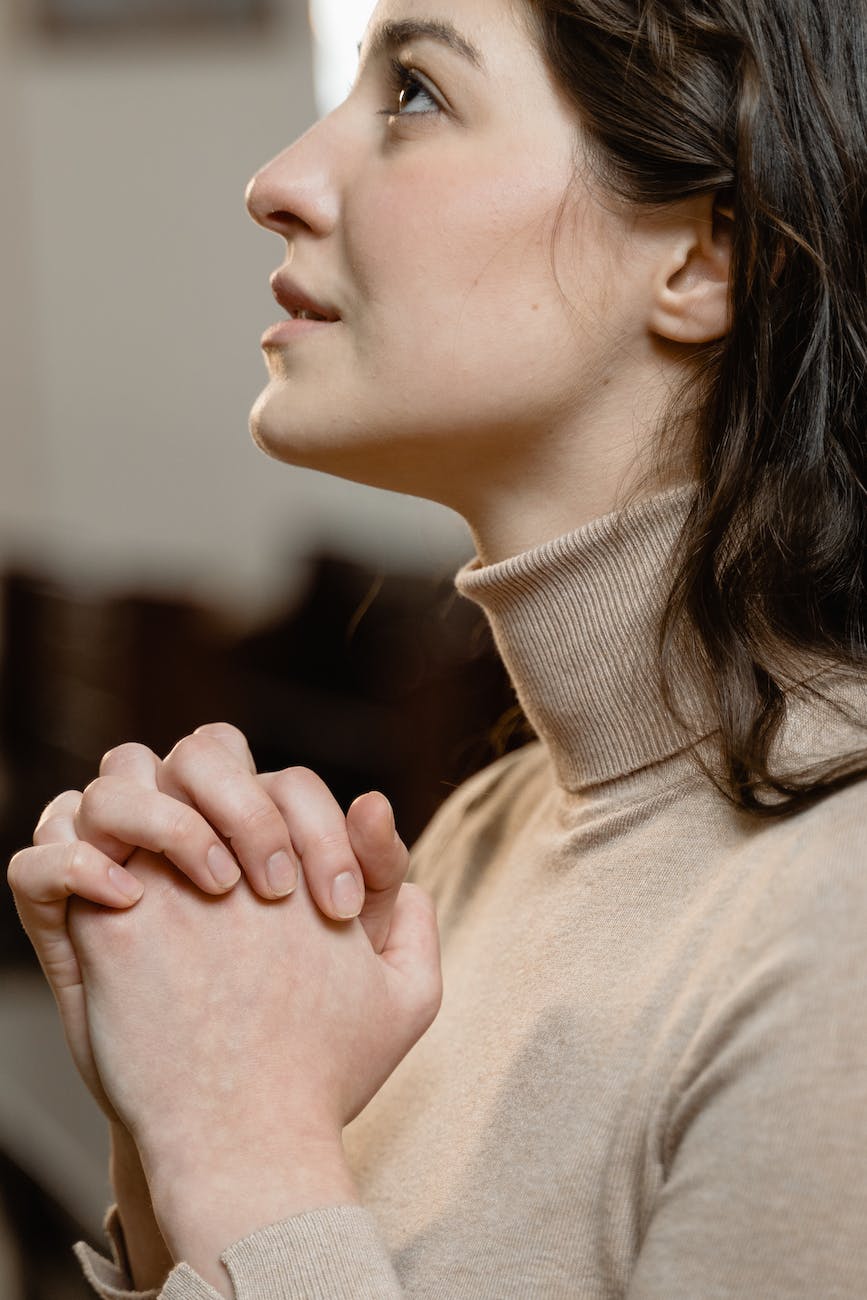 close up view of a woman praying